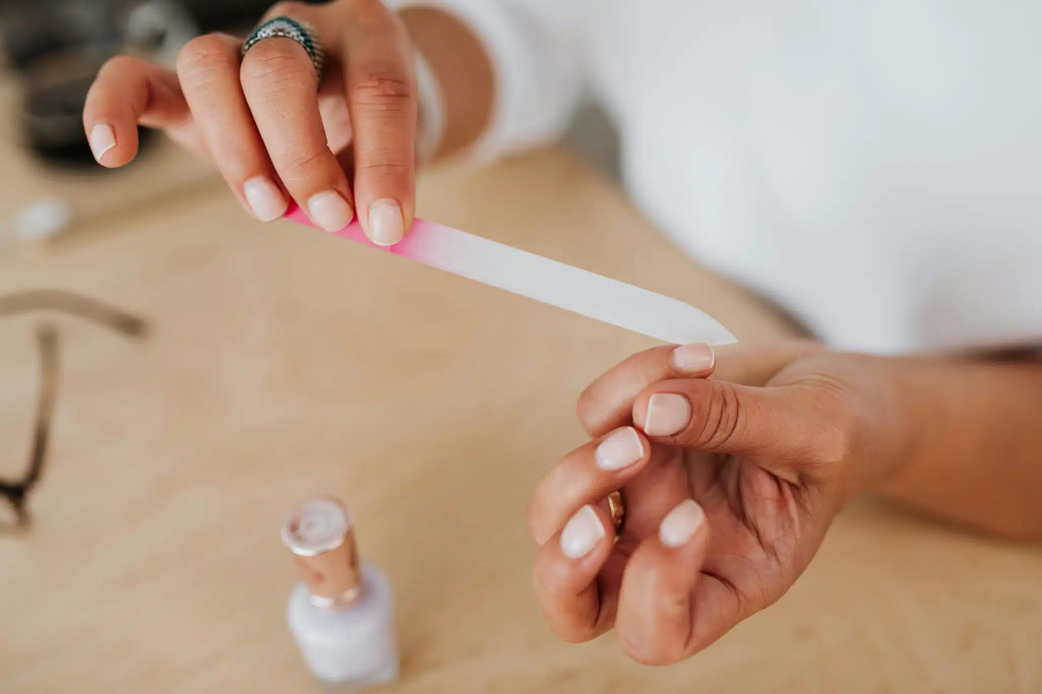 Woman filing nails