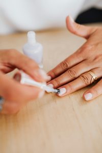 woman painting her nails