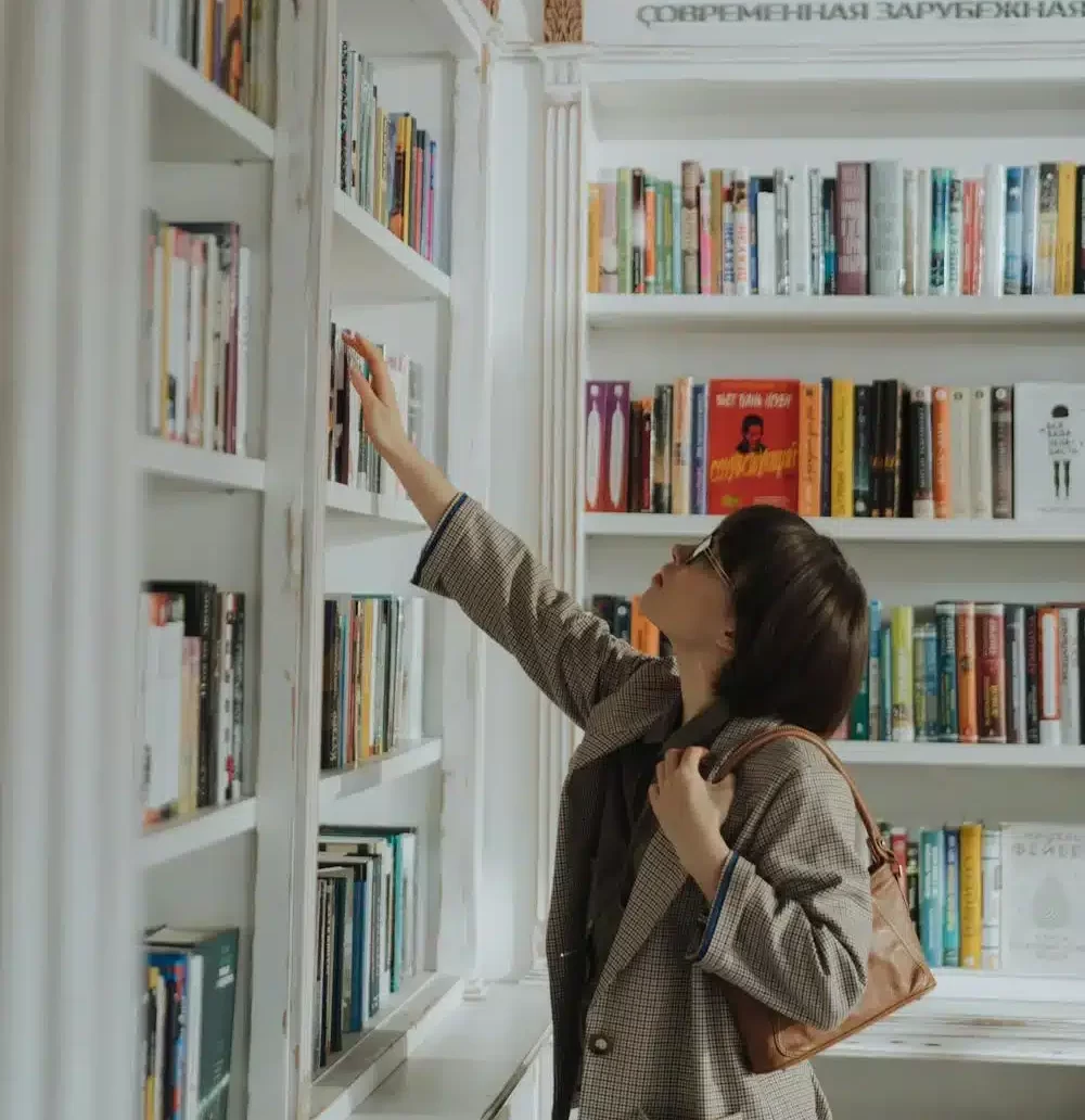 Woman looking through library