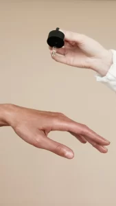 Woman applying body oil to hands