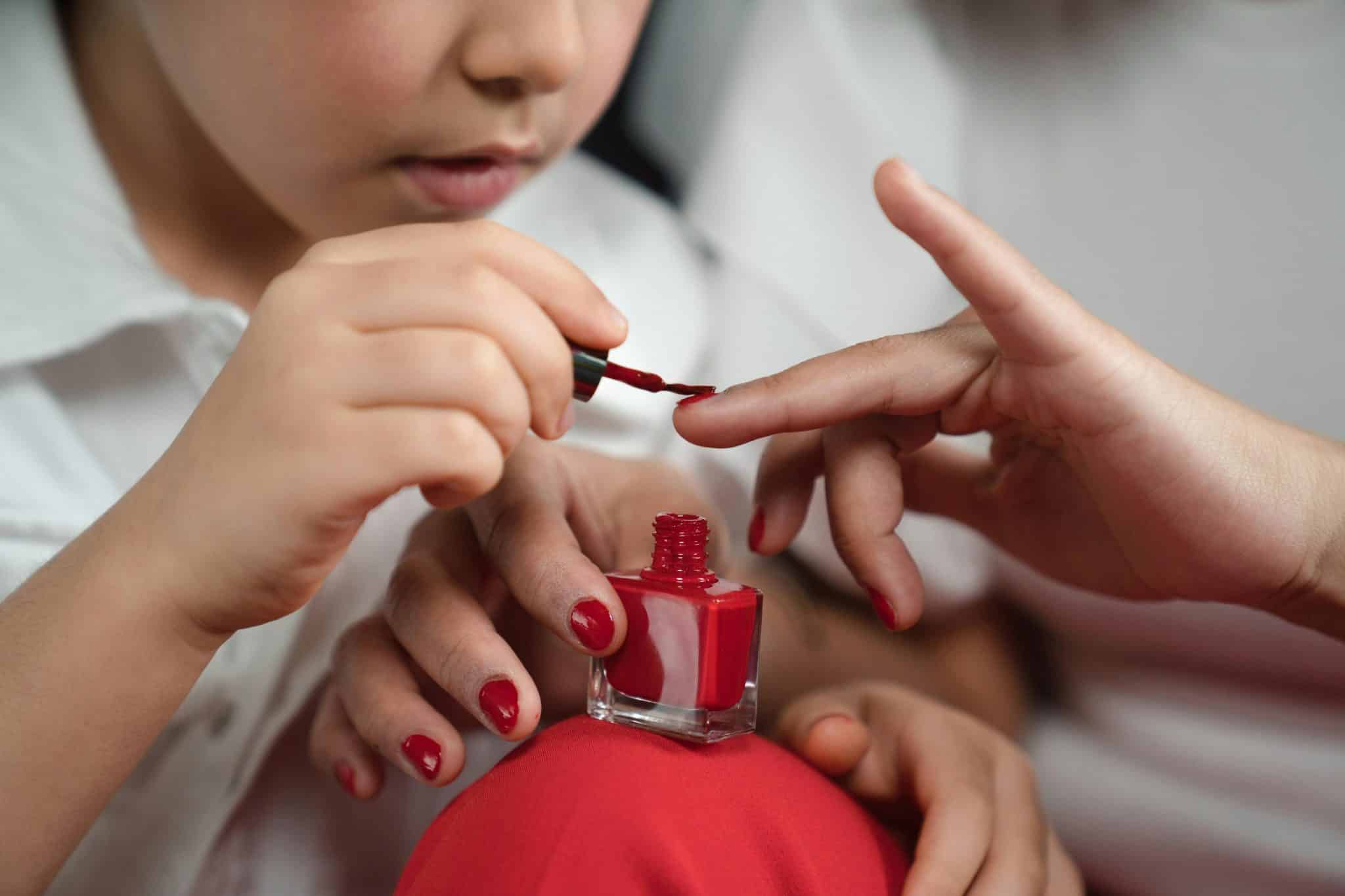 daughter painting mother's nails