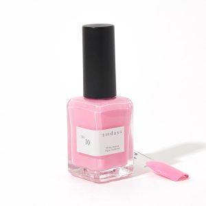 A bottle of sundays No.10 light pink nail polish in front of a white background.