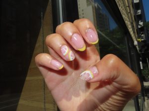 Clear gel manicure with lemon nail art.