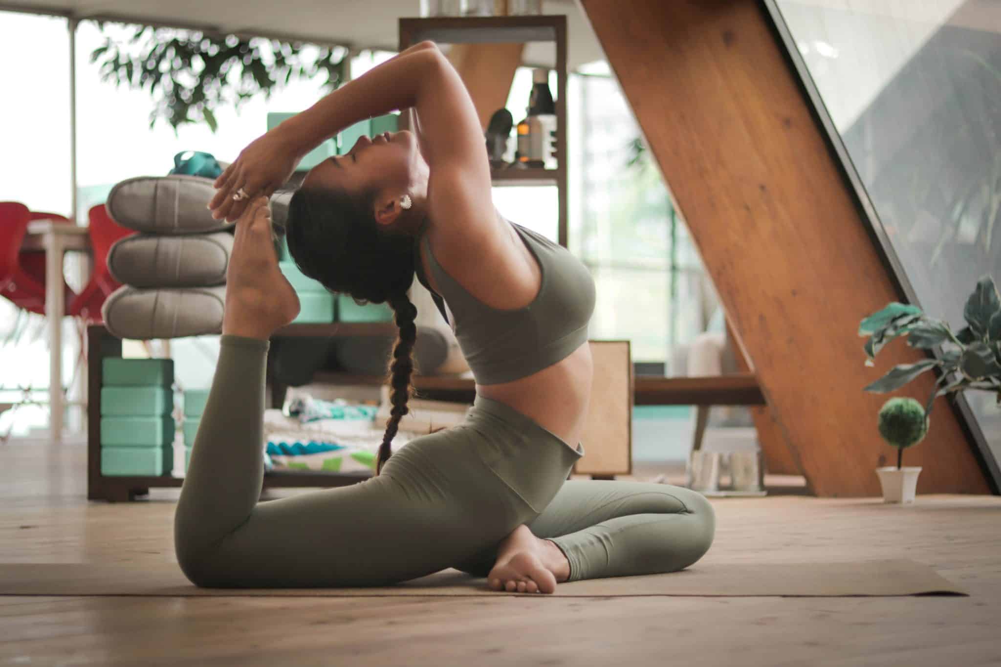 woman doing yoga in green activewear set